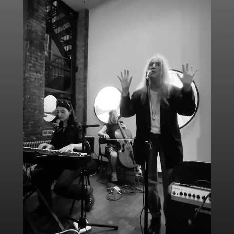 Patti Smith performing at the No Matter What exhibit opening with Rebecca Foon and her daughter Jess Paris Smith.