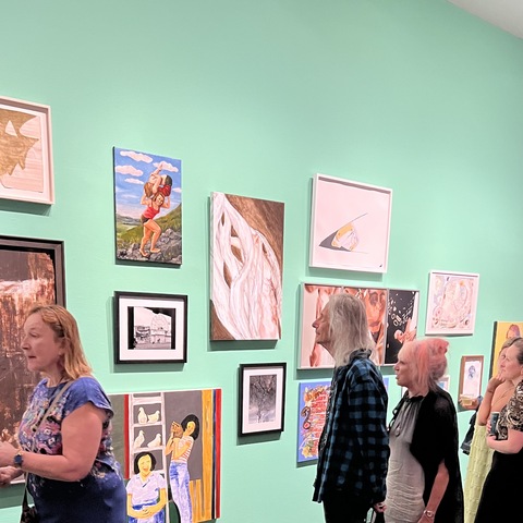 Lenny Kaye admiring Dana Ellyn's portrait of Hannah Arendt